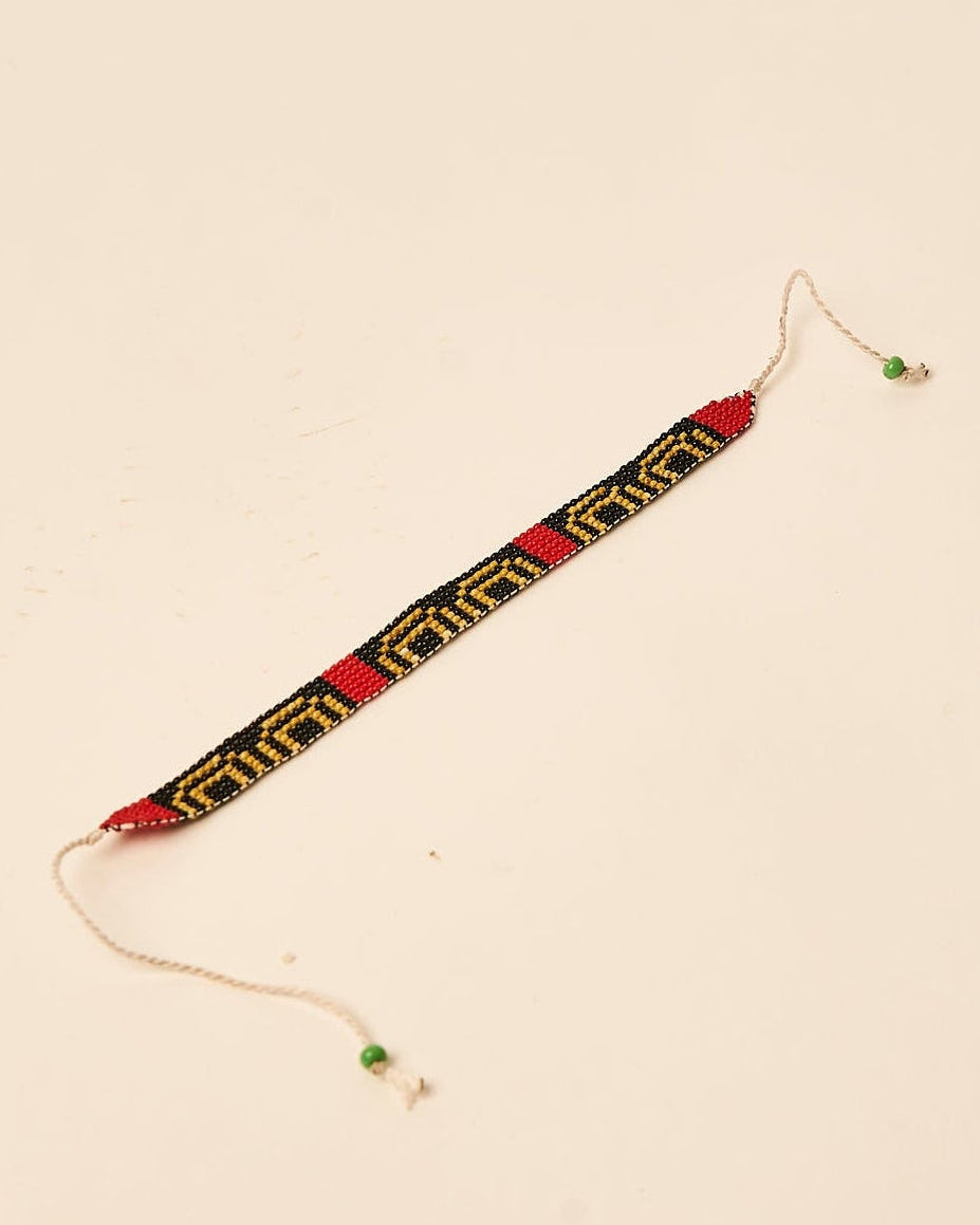 Pulseira de Miçanga Ajustável Waura Preta, Dourada e Vermelha · 16 cm